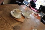 Empty coffee and latte cups on a wooden table