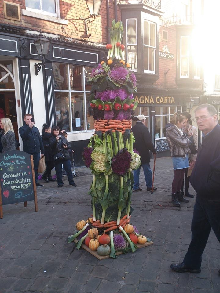 A picture of a vegetable tower at the Farmers market
