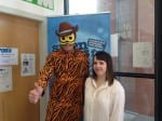 Alice (me) and Mr Tay the vegan tiger man. He is wearing a tiger onesie and has a cowboy hat and bee mask on