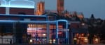Photo: University of Lincoln via Google. Odeon cinema situated on the Brayford Wharf. The building outline has blue lighting around it and Lincoln cathedral is in the background.