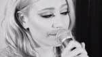 This is a picture of Pixie Lott singing.
