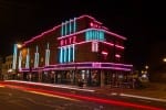 Photo: The Ritz via Facebook The Ritz is located above the Weatherspoons and is located off the High Street. The Ritz light up in neon pink and blue lights.